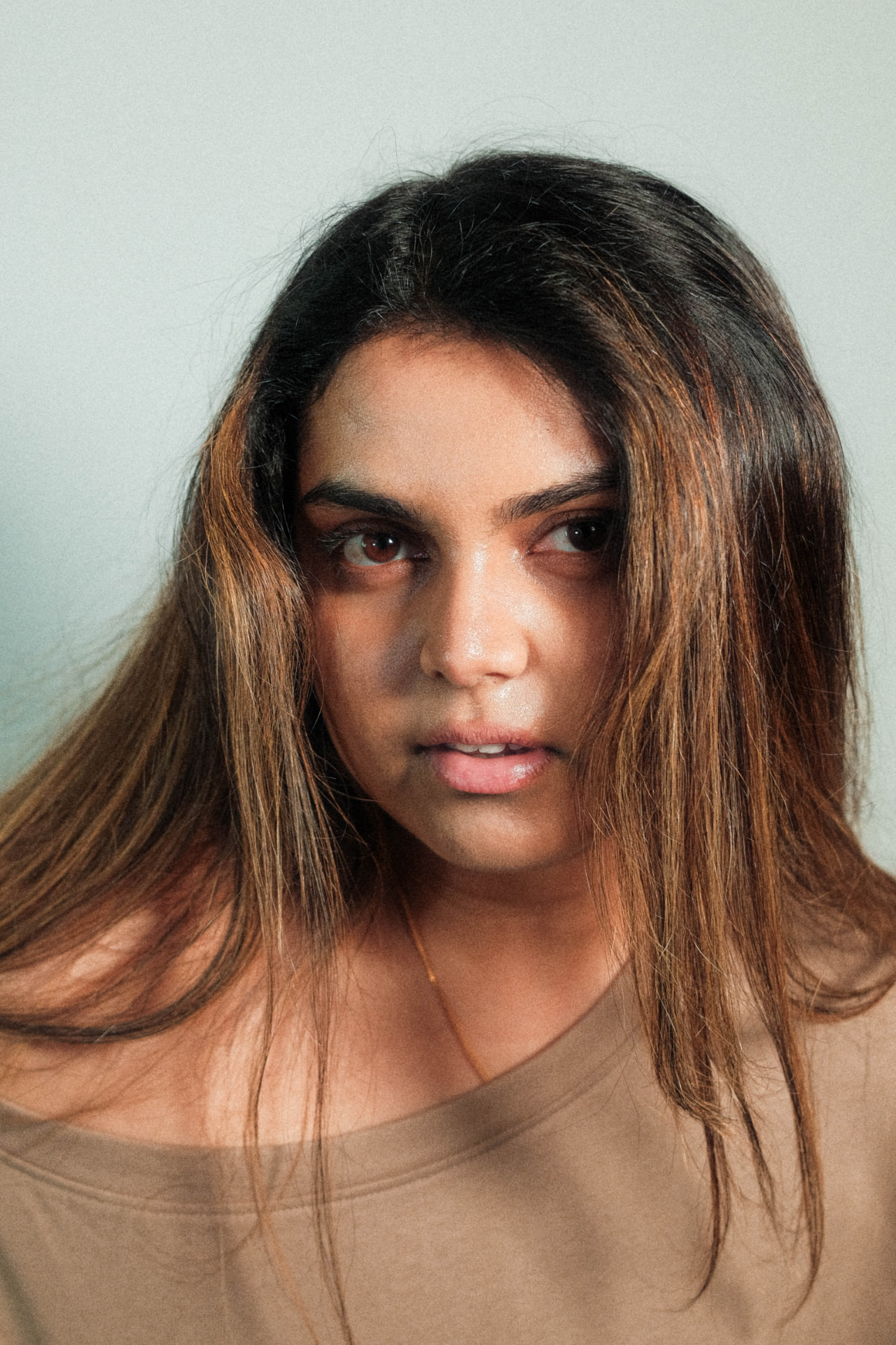 Studio portrait of Nithya, Monnaro co-founder, looking towards the camera